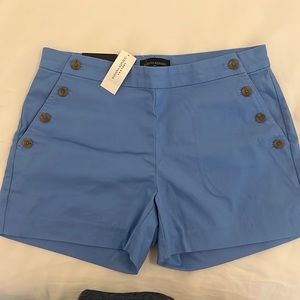 Blue shorts with button detail on pockets